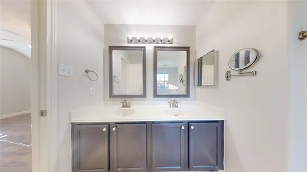 a bathroom with a bathtub and a sink