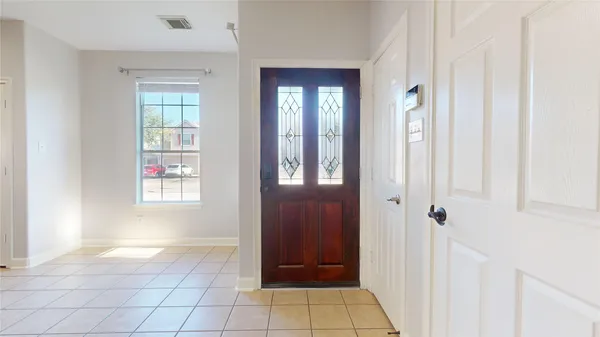 an aerial view of a house with a wooden floor and a floor to ceiling window