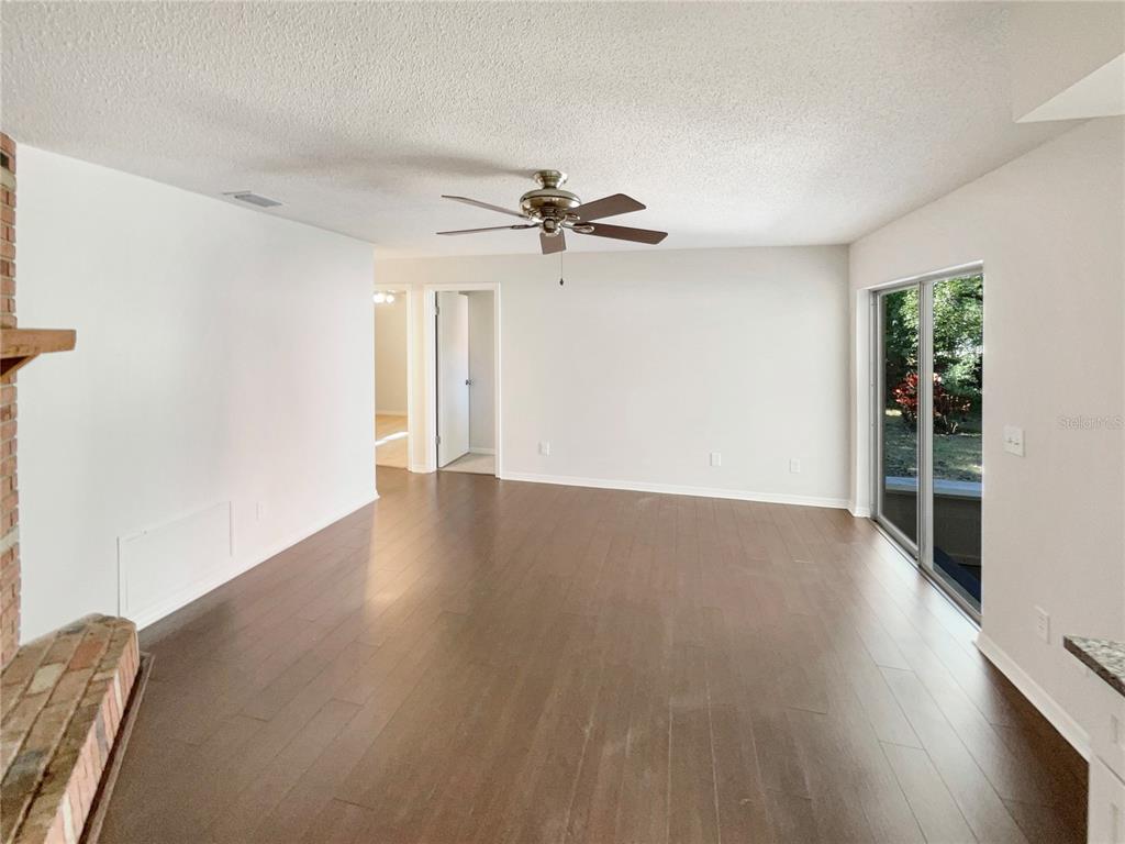 352 Sesame Avenue Apopka, FL 32703 - Photo 19 of 27 wooden floor in an empty room with a window