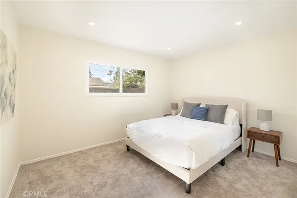 a large white bed in a white room