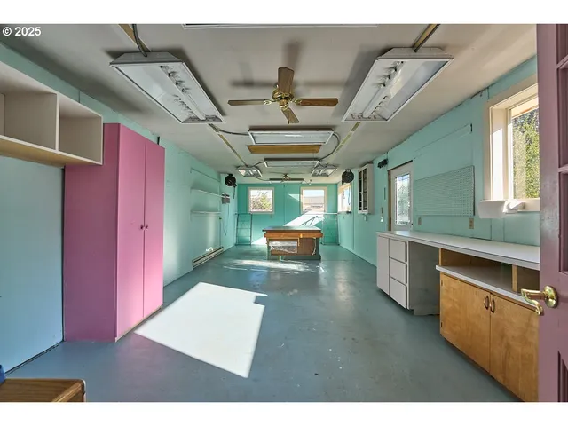 a kitchen with stainless steel appliances kitchen island granite countertop a stove a sink dishwasher and a microwave