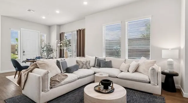 a living room with furniture and a large window