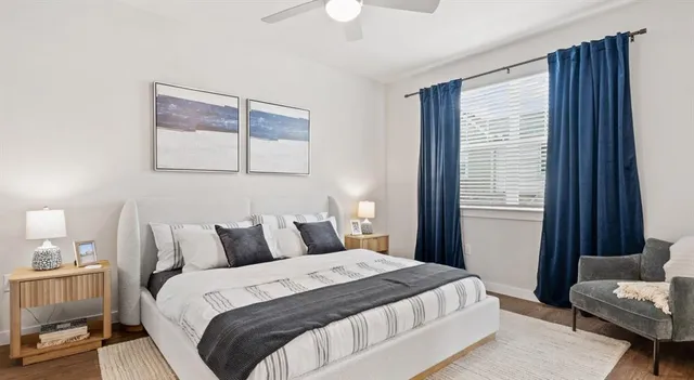 a bedroom with bed and a chandelier