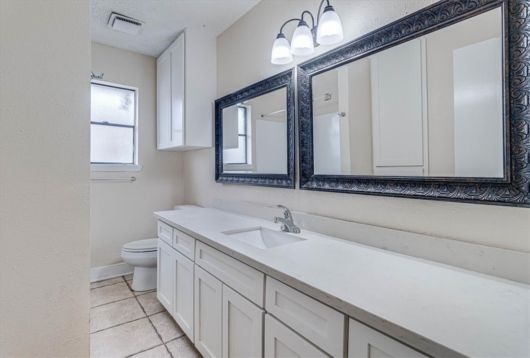 985 Crossbill Street Corpus Christi, TX 78418 - Photo 19 of 40 a bathroom with a sink and a mirror
