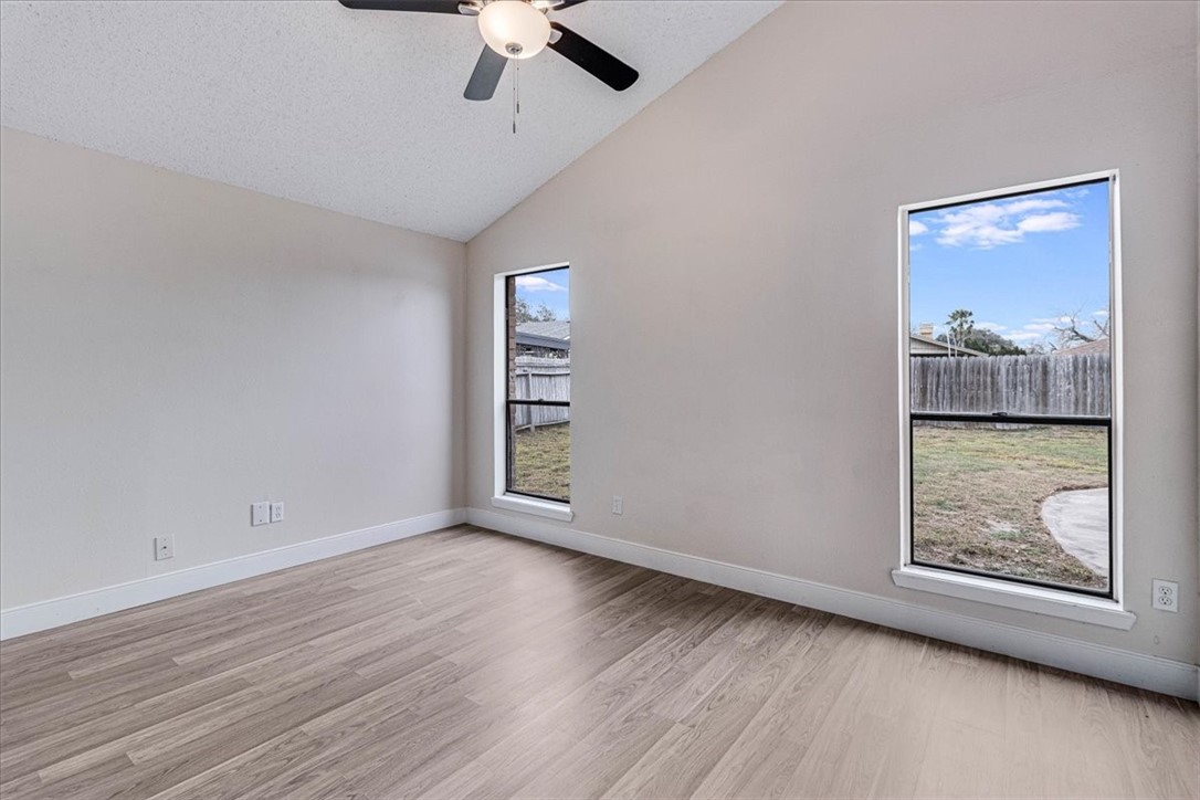 985 Crossbill Street Corpus Christi, TX 78418 - Photo 26 of 40 wooden floor in an empty room with a window
