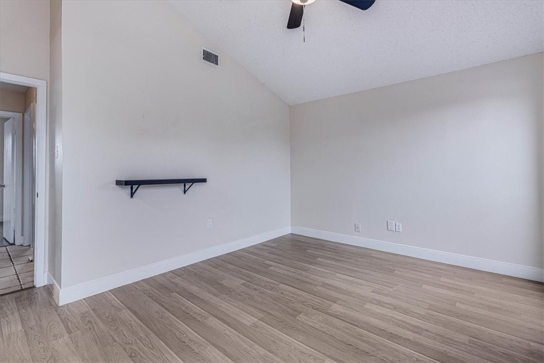 985 Crossbill Street Corpus Christi, TX 78418 - Photo 27 of 40 a view of a room with wooden floor