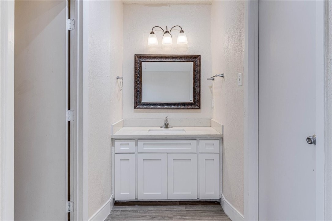 985 Crossbill Street Corpus Christi, TX 78418 - Photo 30 of 40 a bathroom with a sink and a mirror