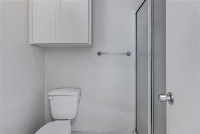 a view of a hallway with a wooden fence