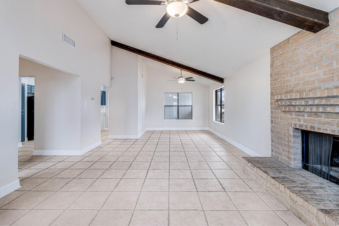 985 Crossbill Street Corpus Christi, TX 78418 - Photo 4 of 40 a view of empty room with window and fireplace