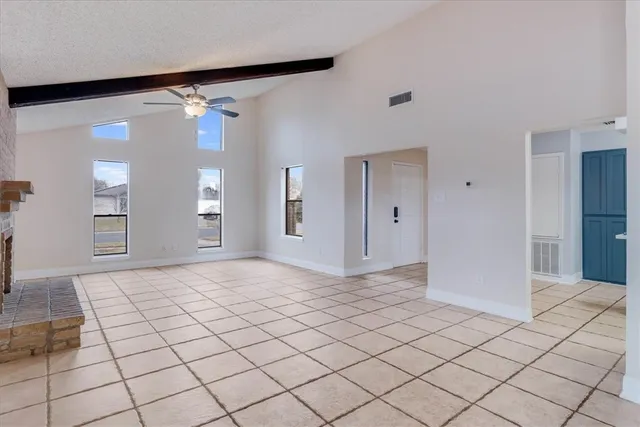 a view of an empty room and window