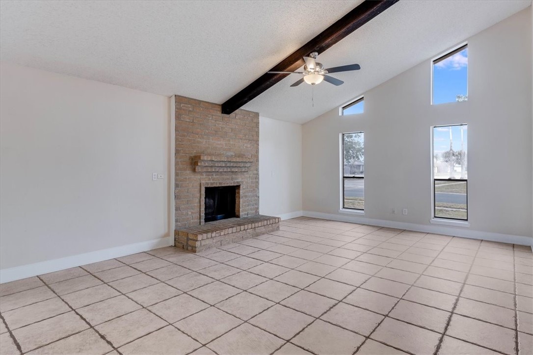 985 Crossbill Street Corpus Christi, TX 78418 - Photo 8 of 40 a view of an empty room with a fireplace