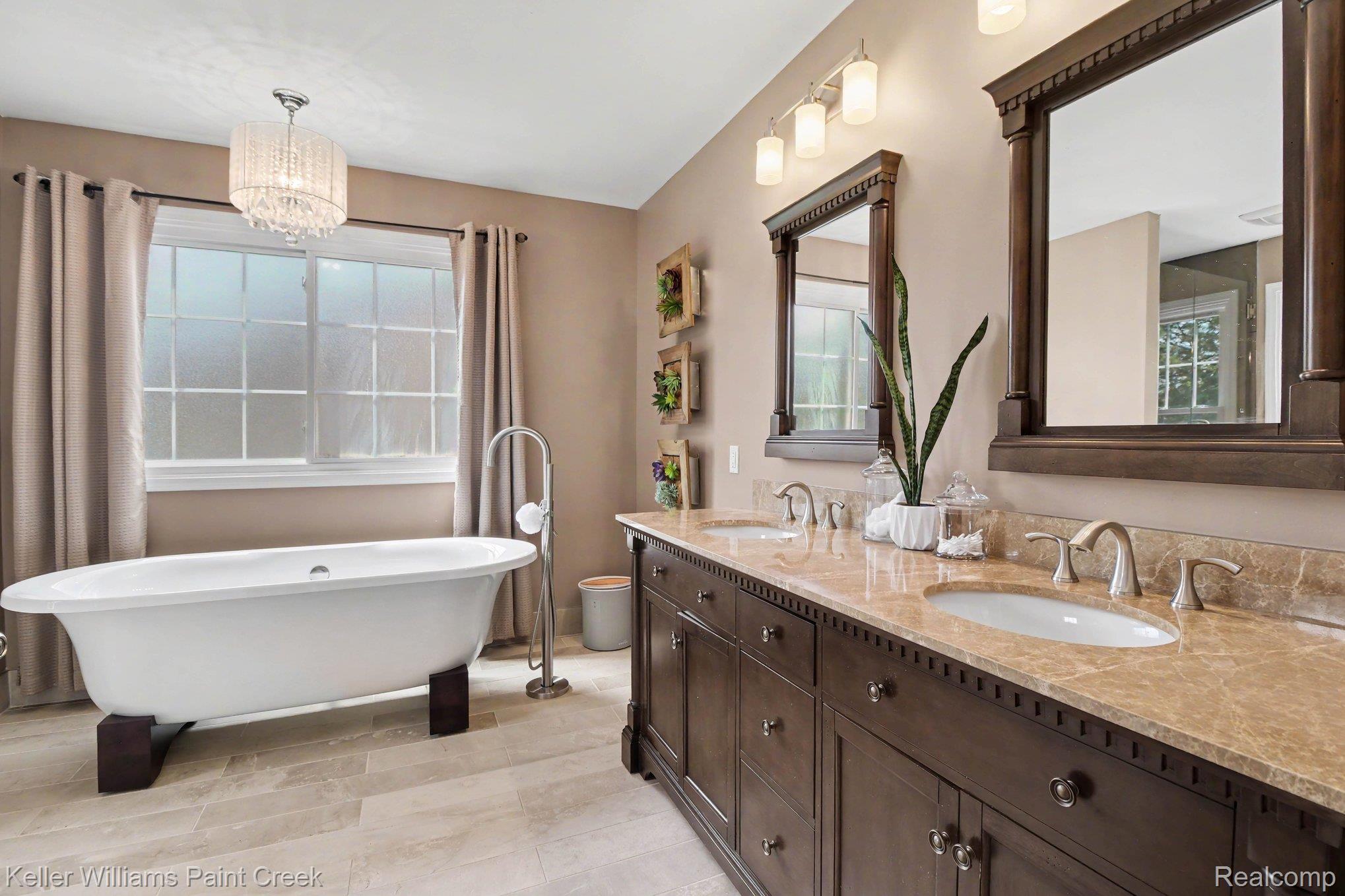 4139 Wincrest Lane Rochester, MI 48306 - Photo 13 of 34 The primary bath is a serene spa-like retreat.