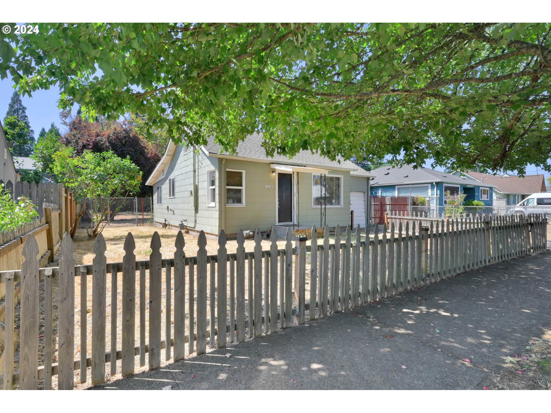 1004 North 3rd Place Springfield, OR 97477 - Photo 32 of 33 a view of a house with wooden fence