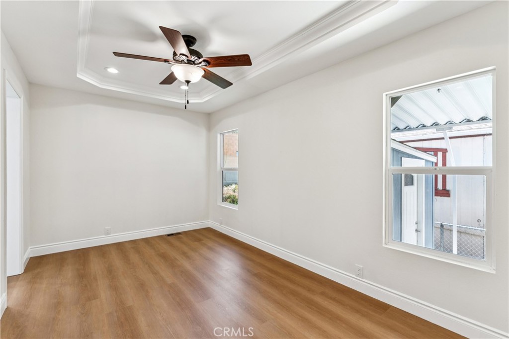 10550 Dunlap Crossing Road, Unit 141 Whittier, CA 90606 - Photo 18 of 38 wooden floor in an empty room with a window