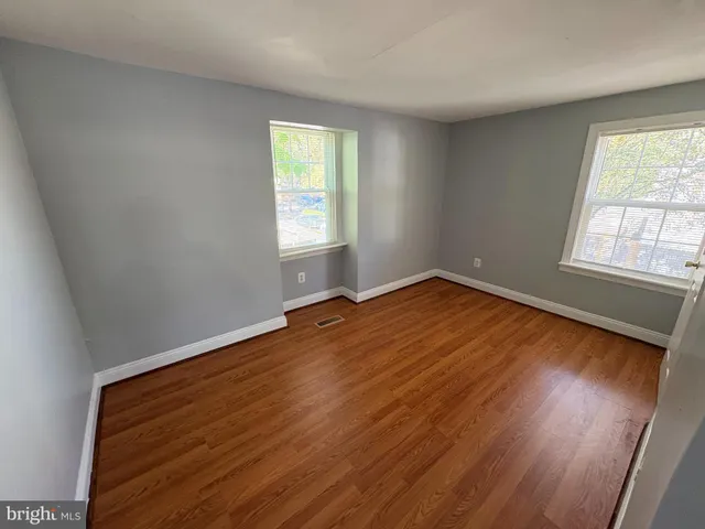 wooden floor in a hall with an entryway