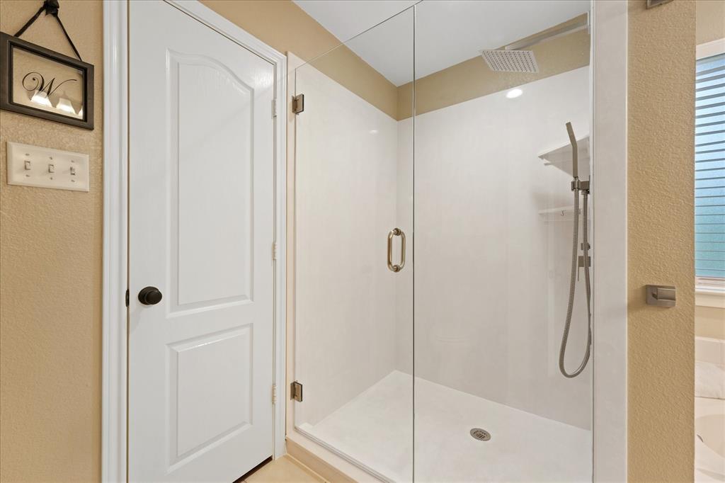 112 Springfield Lane Red Oak, TX 75165 - Photo 19 of 40 Glass-enclosed shower featuring a rainfall showerhead, handheld shower fixture, and recessed lighting
