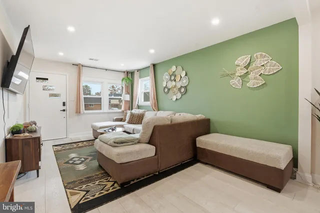 a bedroom with a bed and a couch