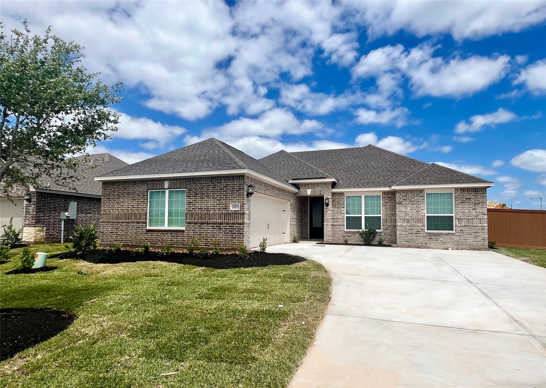 3202 Bolt Rope Drive Texas City, TX 77510 - Photo 2 of 18 a front view of a house with a yard