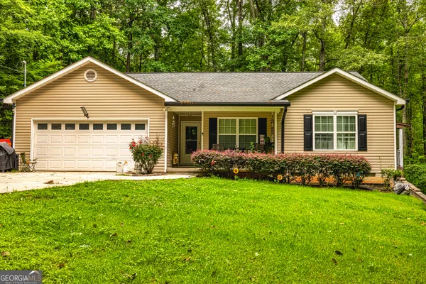 a front view of a house with a yard