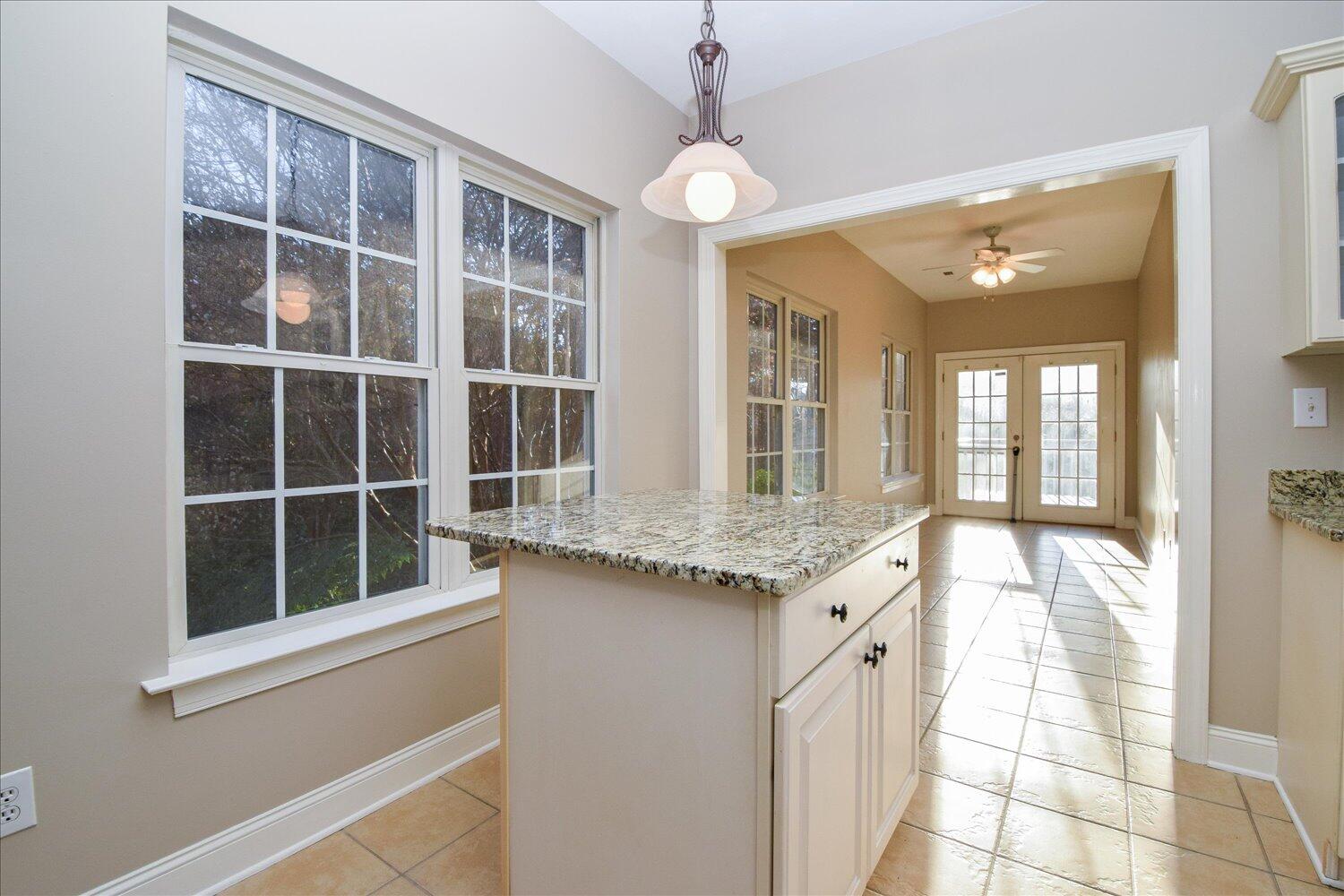 2271 Countryside Road Northwest Roanoke, VA 24017 - Photo 5 of 27 a bathroom with a granite countertop sink and large windows