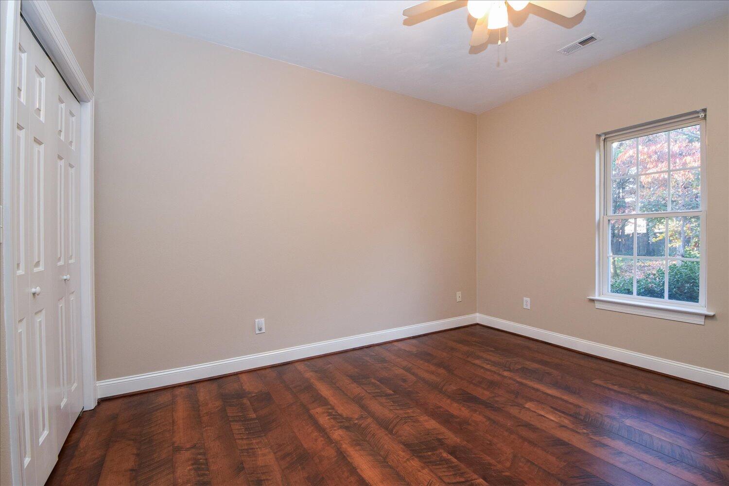 2271 Countryside Road Northwest Roanoke, VA 24017 - Photo 10 of 27 a view of an empty room with wooden floor and a window