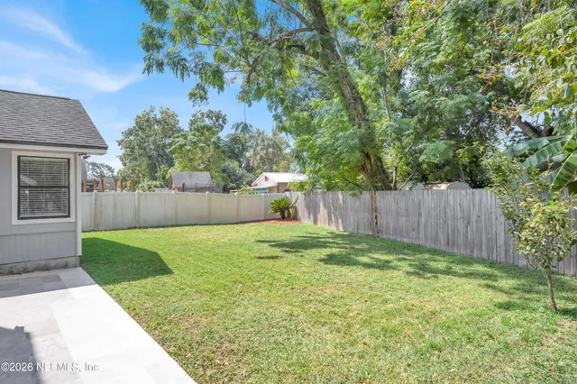 a backyard of a house with seating space