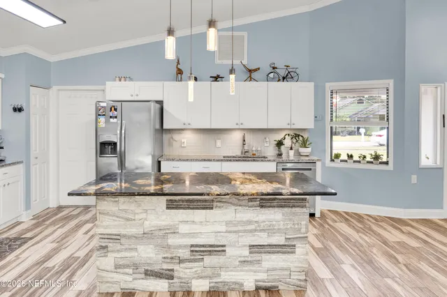 a front view of a house with a yard and seating area