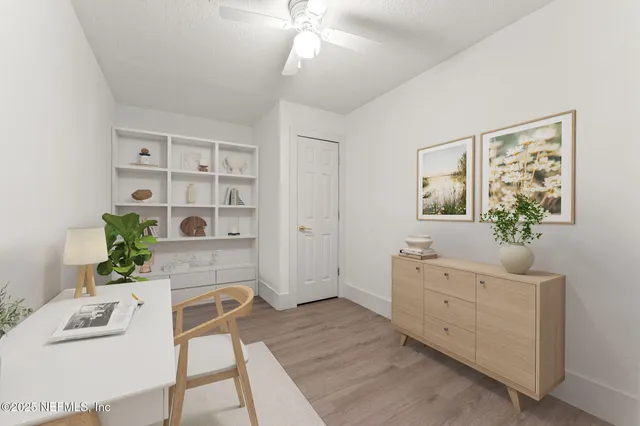 a spacious bedroom with a bed and a desk in it