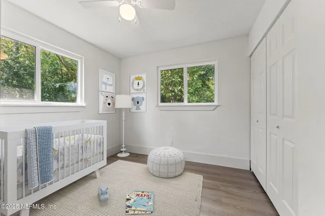 a bedroom with furniture and a window