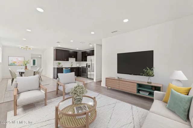 a living room with furniture and a flat screen tv