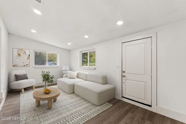 a living room with furniture and a window