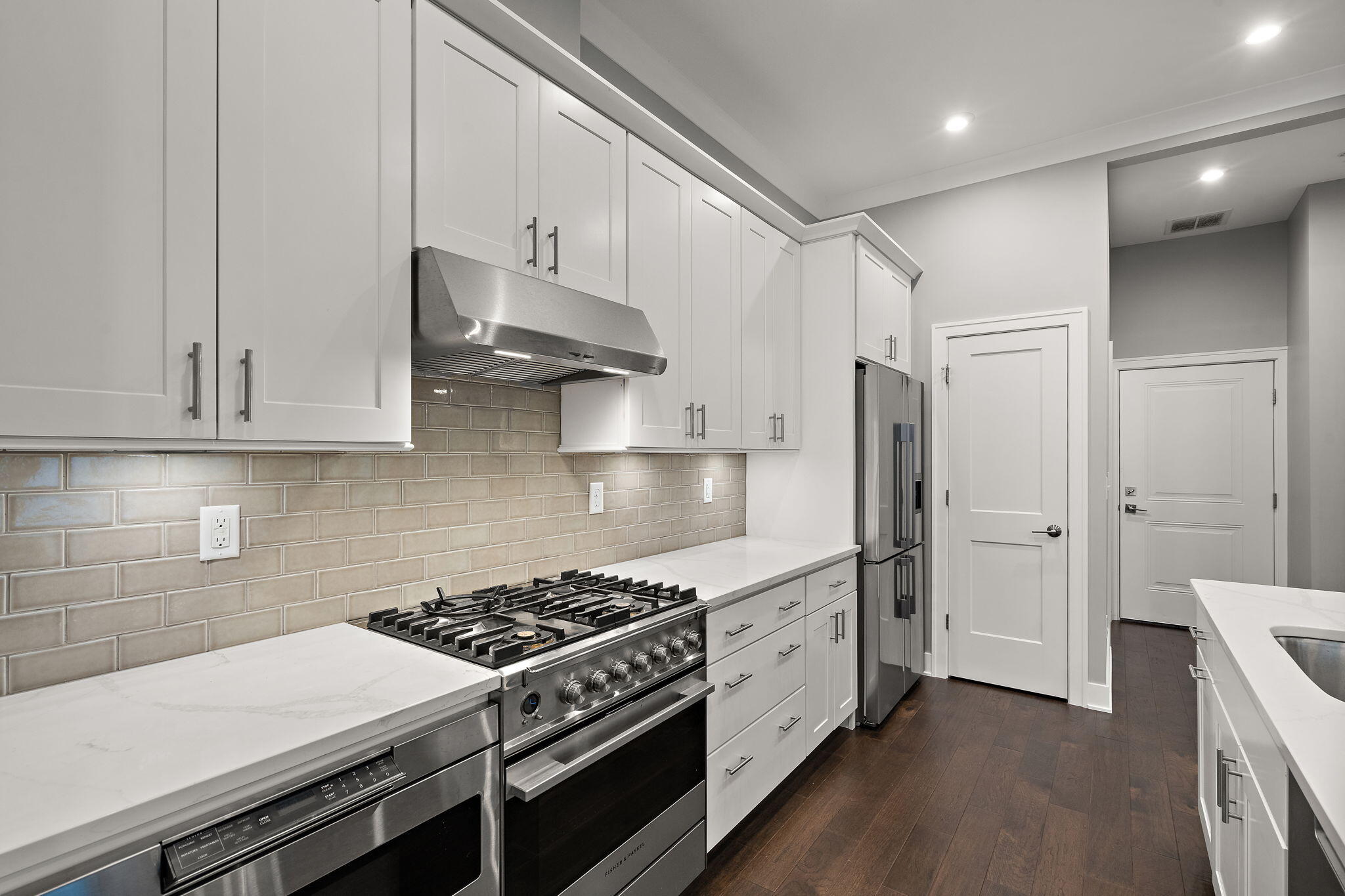 207 Academy Street, Unit 106 Valparaiso, IN 46385 - Photo 11 of 43 a kitchen with stainless steel appliances a stove a refrigerator and cabinets