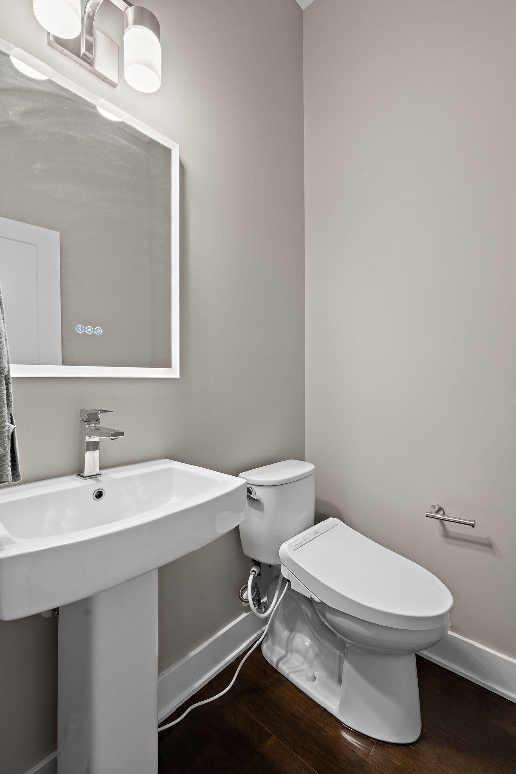 207 Academy Street, Unit 106 Valparaiso, IN 46385 - Photo 14 of 43 a white toilet sitting next to a bathroom sink