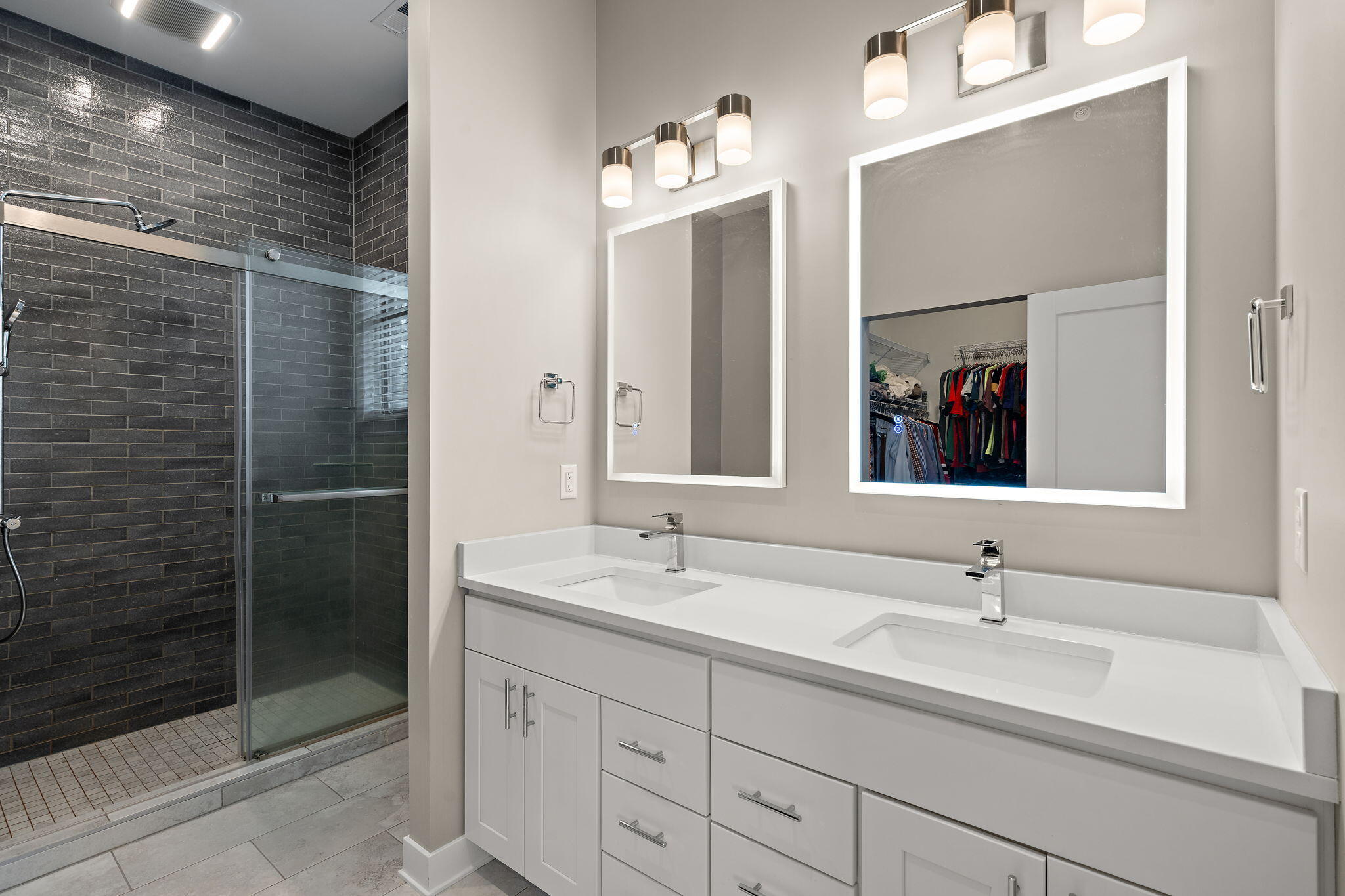207 Academy Street, Unit 106 Valparaiso, IN 46385 - Photo 20 of 43 a bathroom with a double vanity sink mirror and shower
