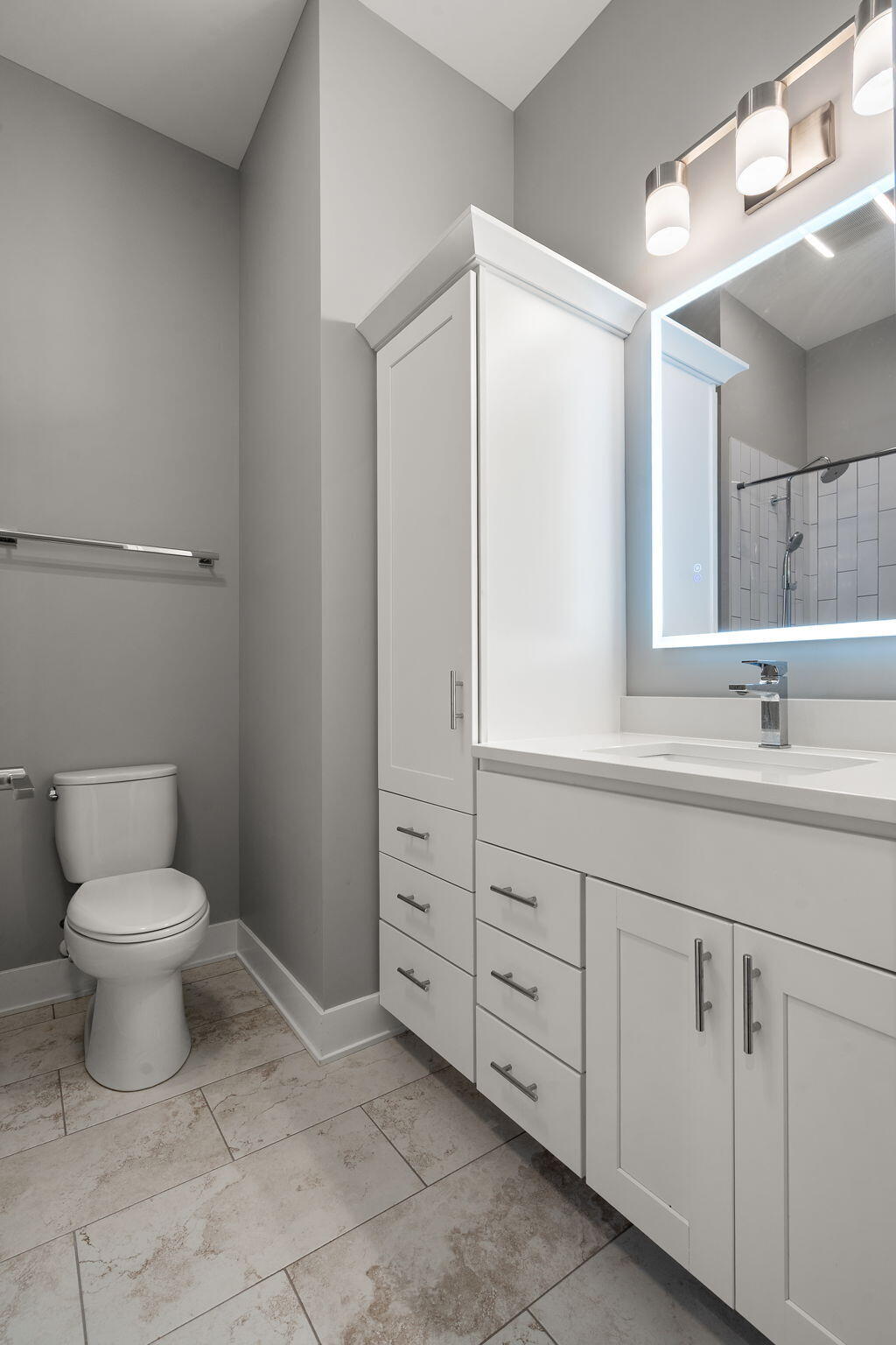 207 Academy Street, Unit 106 Valparaiso, IN 46385 - Photo 24 of 43 a bathroom with a toilet sink and mirror