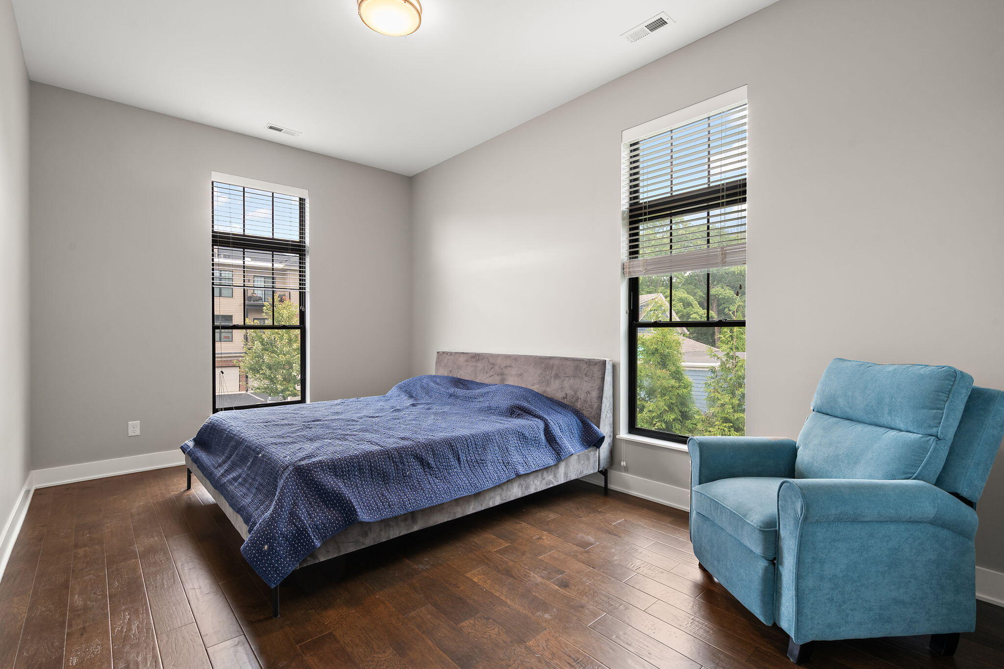 207 Academy Street, Unit 106 Valparaiso, IN 46385 - Photo 28 of 43 a bedroom with a bed and a couch