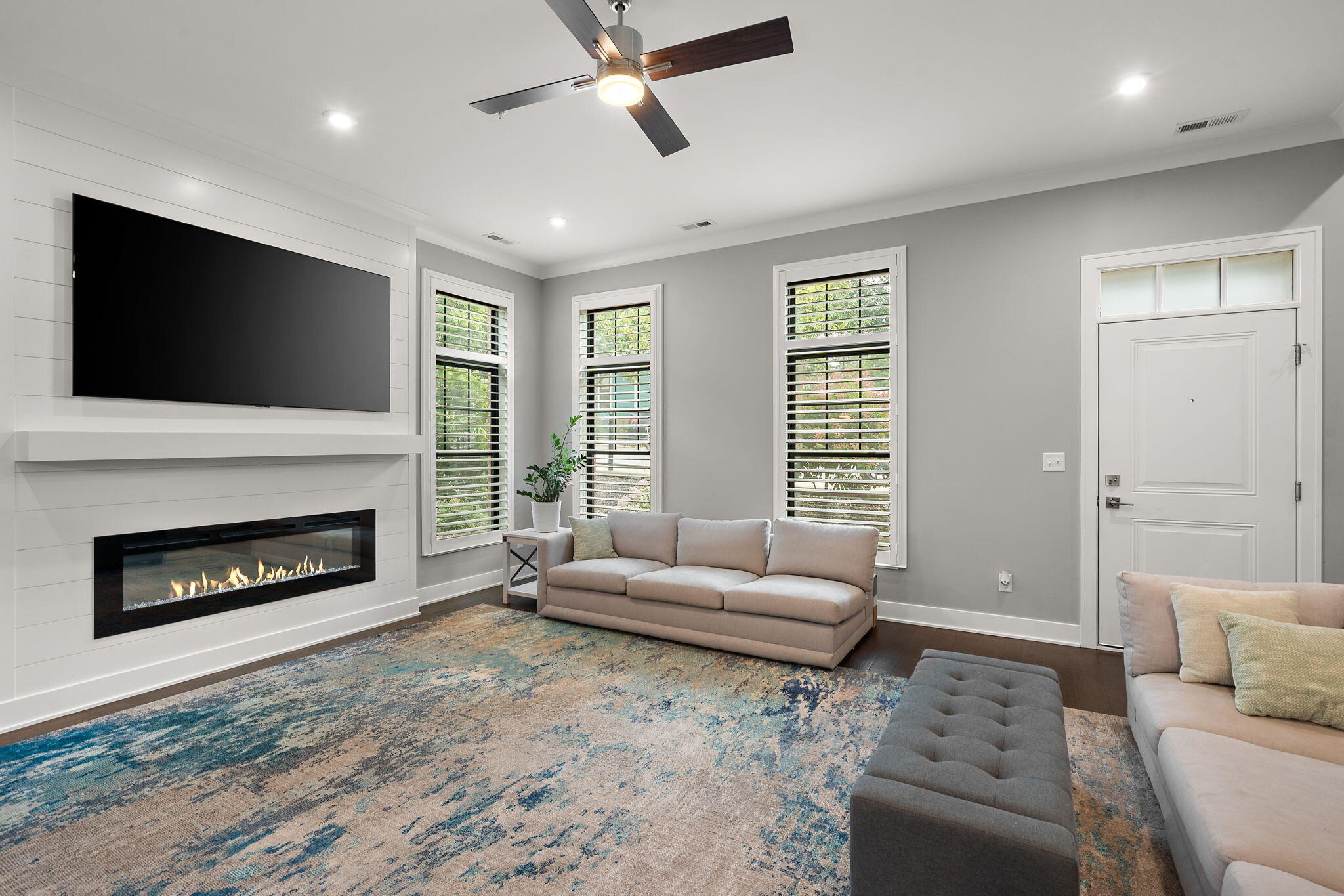 207 Academy Street, Unit 106 Valparaiso, IN 46385 - Photo 5 of 43 a living room with furniture and a fireplace
