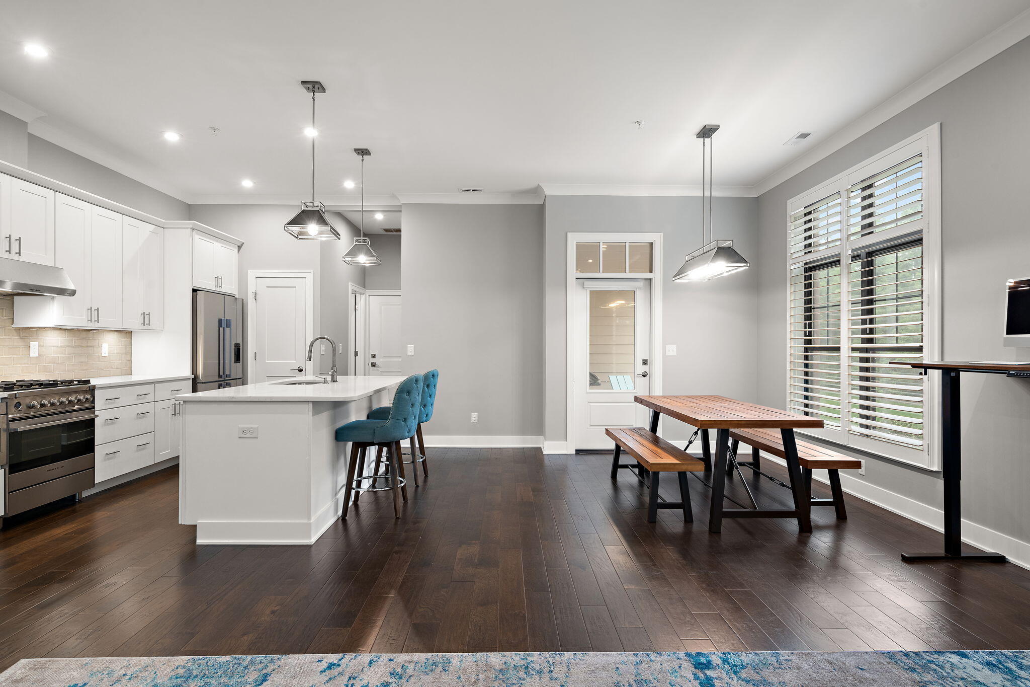 207 Academy Street, Unit 106 Valparaiso, IN 46385 - Photo 6 of 43 a view of a dining room with furniture and wooden floor