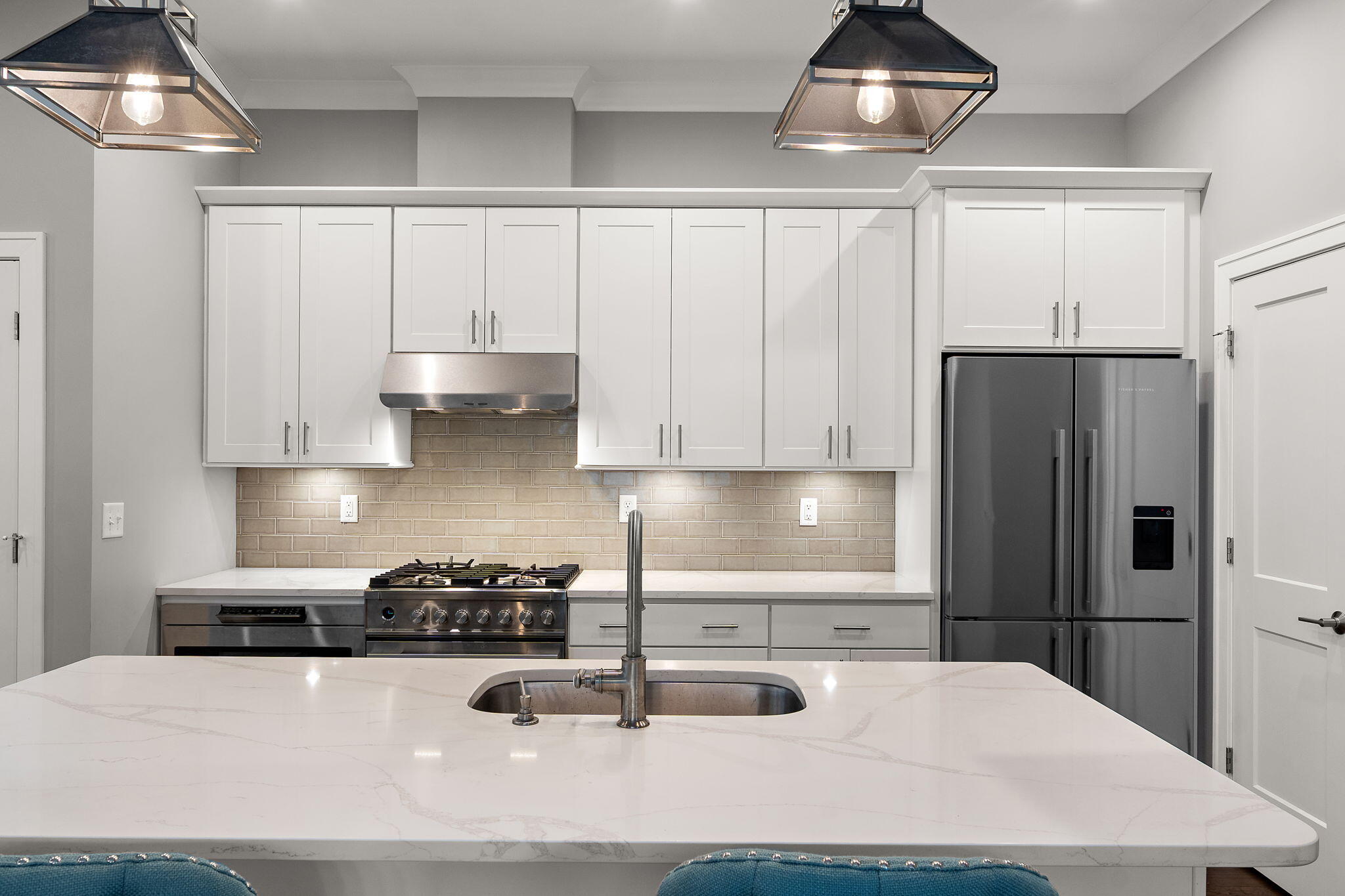 207 Academy Street, Unit 106 Valparaiso, IN 46385 - Photo 10 of 43 a kitchen with stainless steel appliances sinks a refrigerator and cabinets
