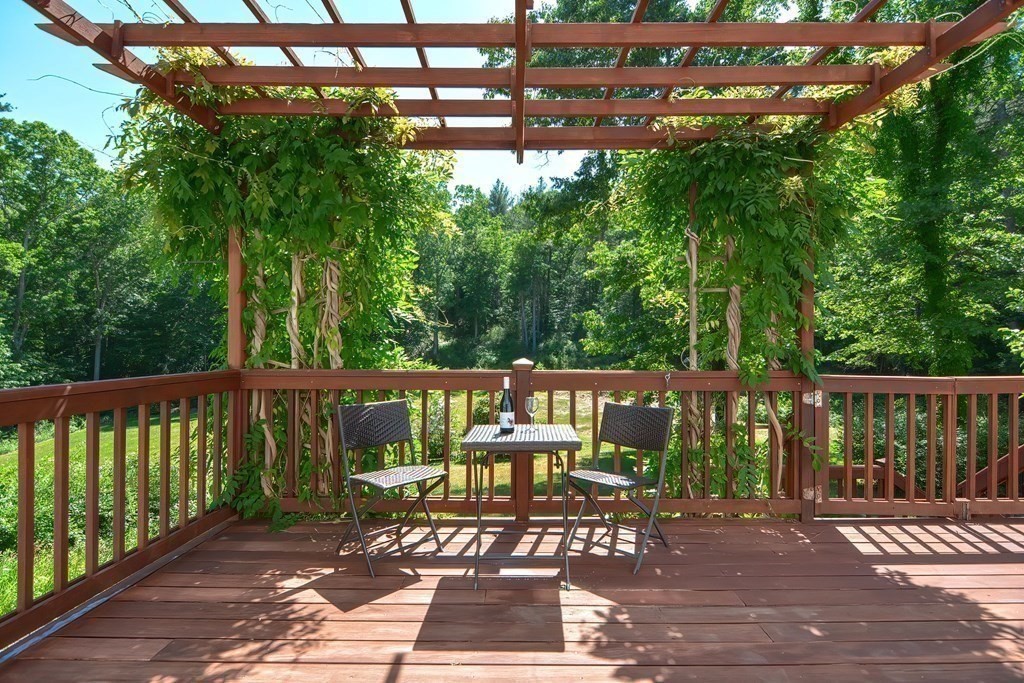 a view of a patio with wooden floor