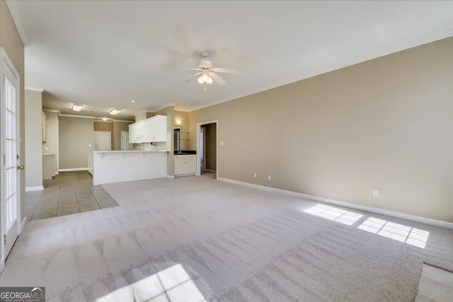 a view of a kitchen with a sink and a window