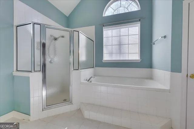 a bathroom with a sink a light fixture and a mirror