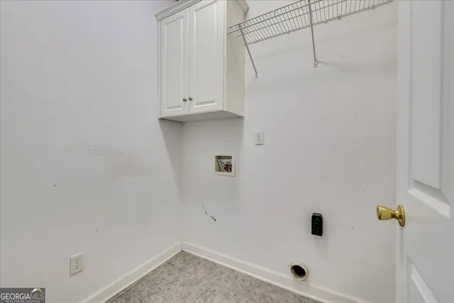 an empty room with a empty space and windows