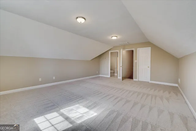 a view of a room with a glass door