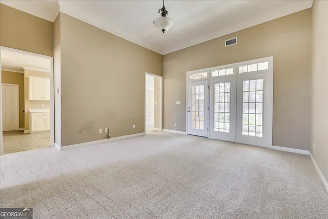 a view of an empty room with a window