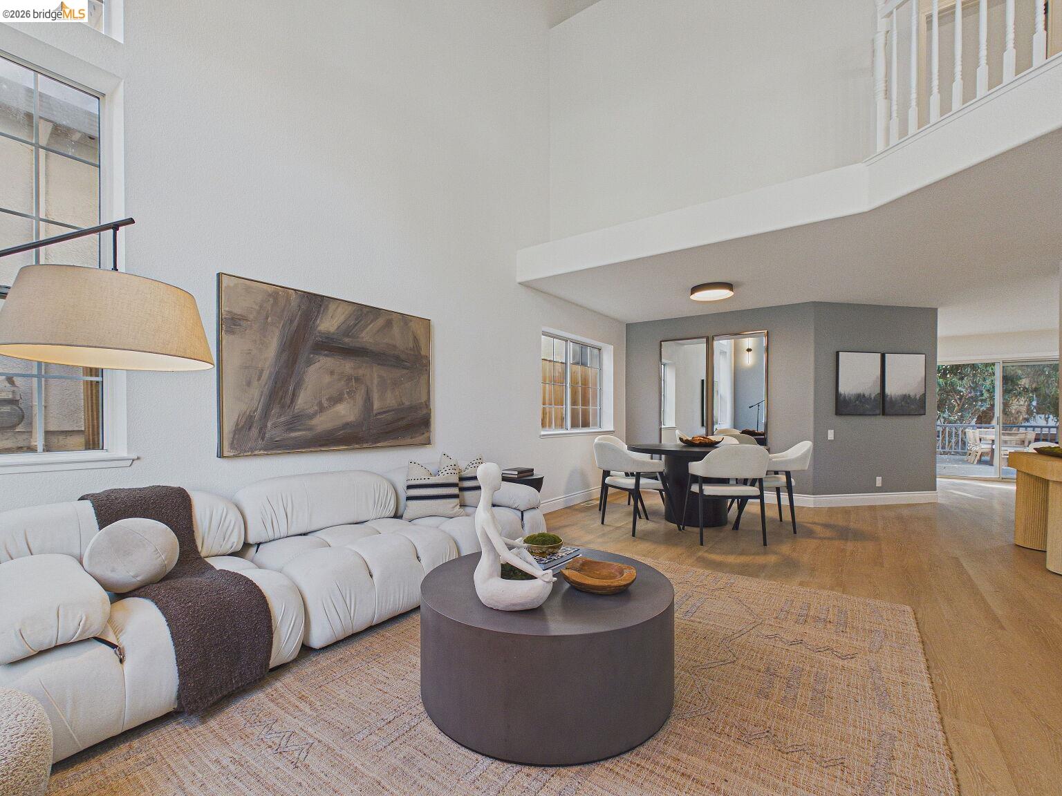 2392 Austin Court Castro Valley, CA 94546 - Photo 16 of 60 Living area featuring light wood-style flooring and a high ceiling