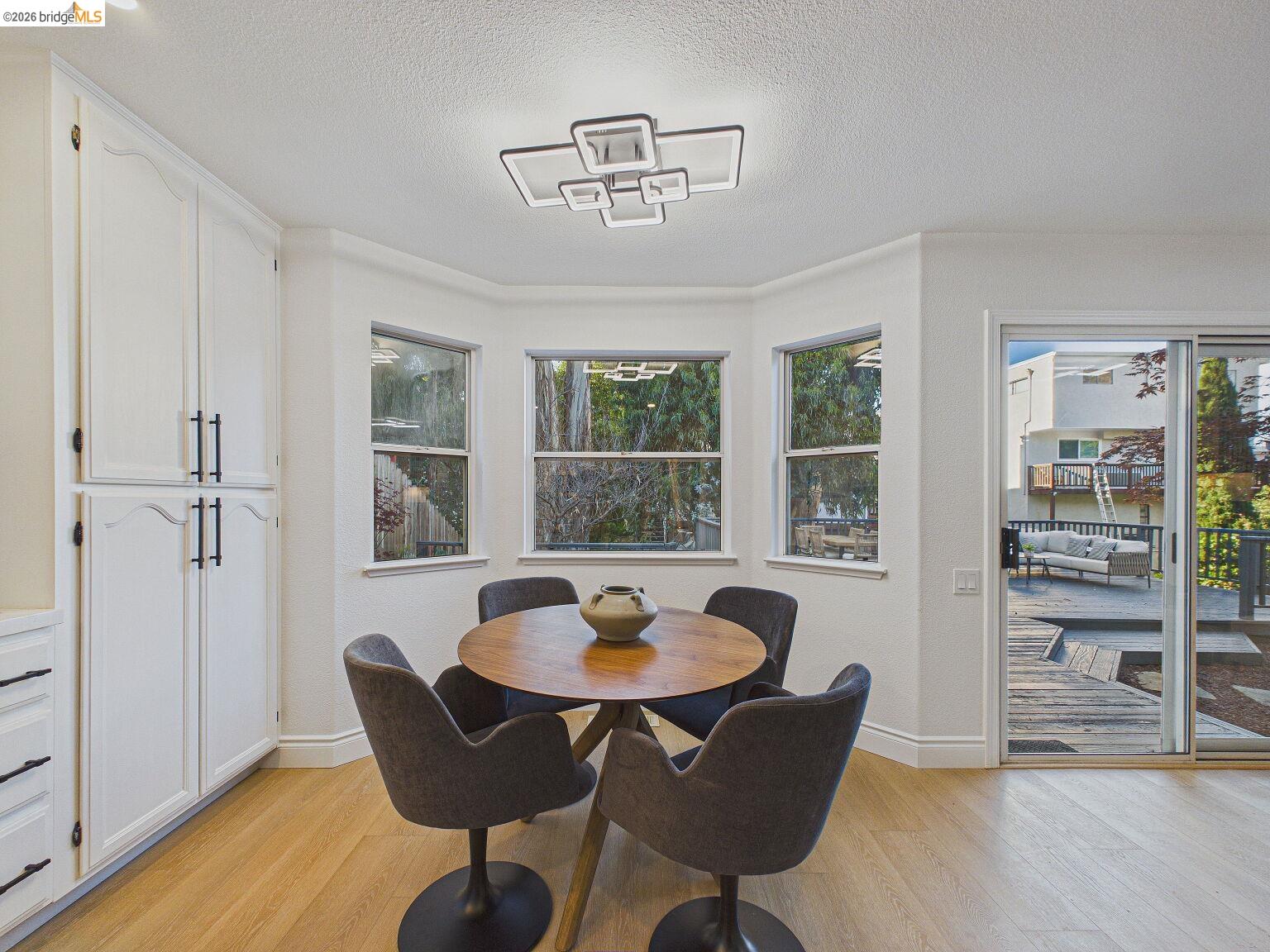 2392 Austin Court Castro Valley, CA 94546 - Photo 24 of 60 Dining area with light wood-style flooring and a textured ceiling