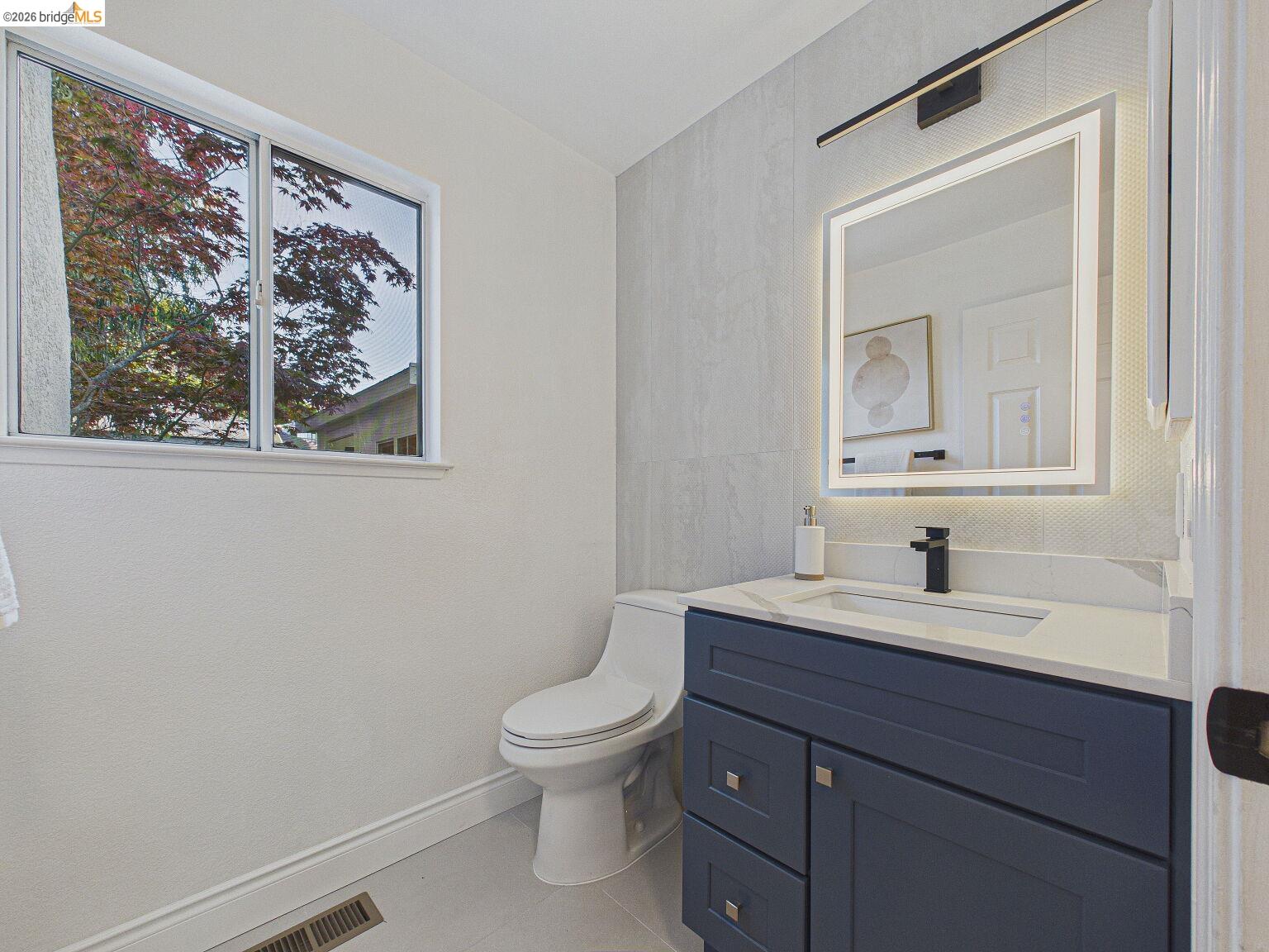 2392 Austin Court Castro Valley, CA 94546 - Photo 33 of 60 Bathroom with vanity, tile walls, and light tile patterned flooring