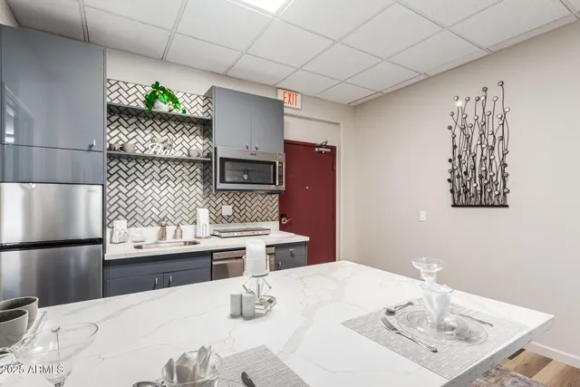 a dining room with a table and chairs