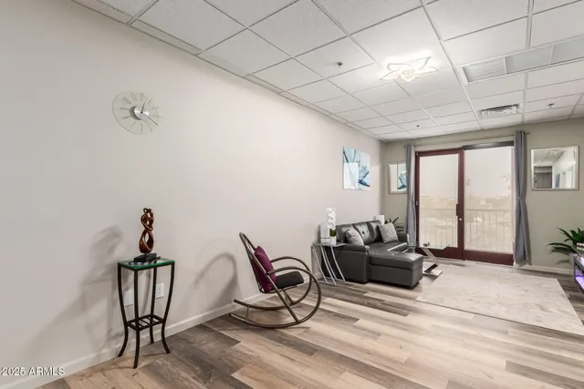 a bedroom with furniture window and a ceiling fan